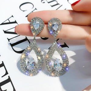 Metal Hyperbole- Round crystal earrings